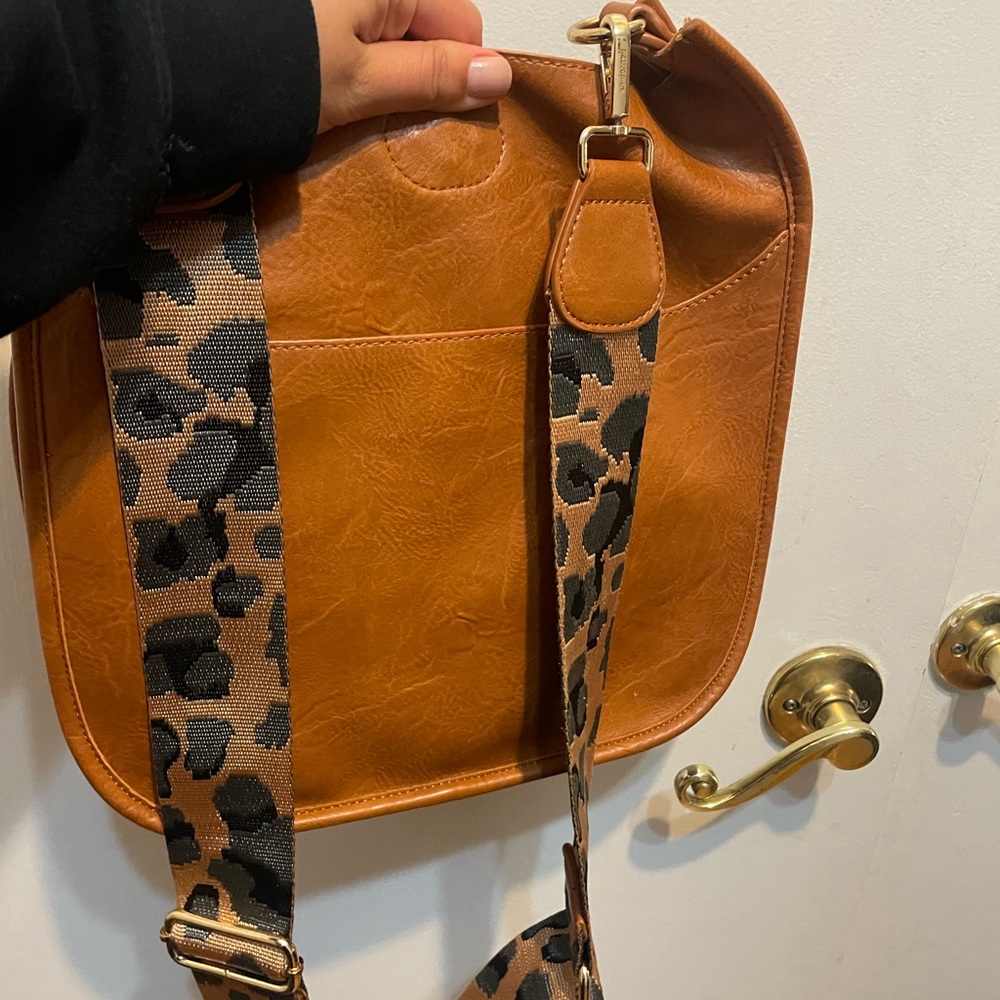 Ah-dorned leather crossbody bag